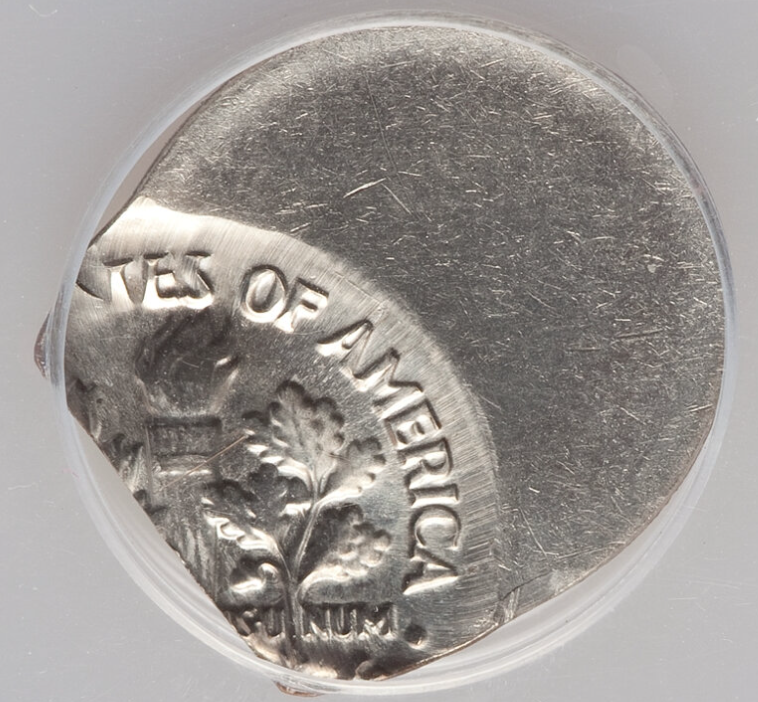 1984 dime off-center strike error showing date still visible with shifted design
