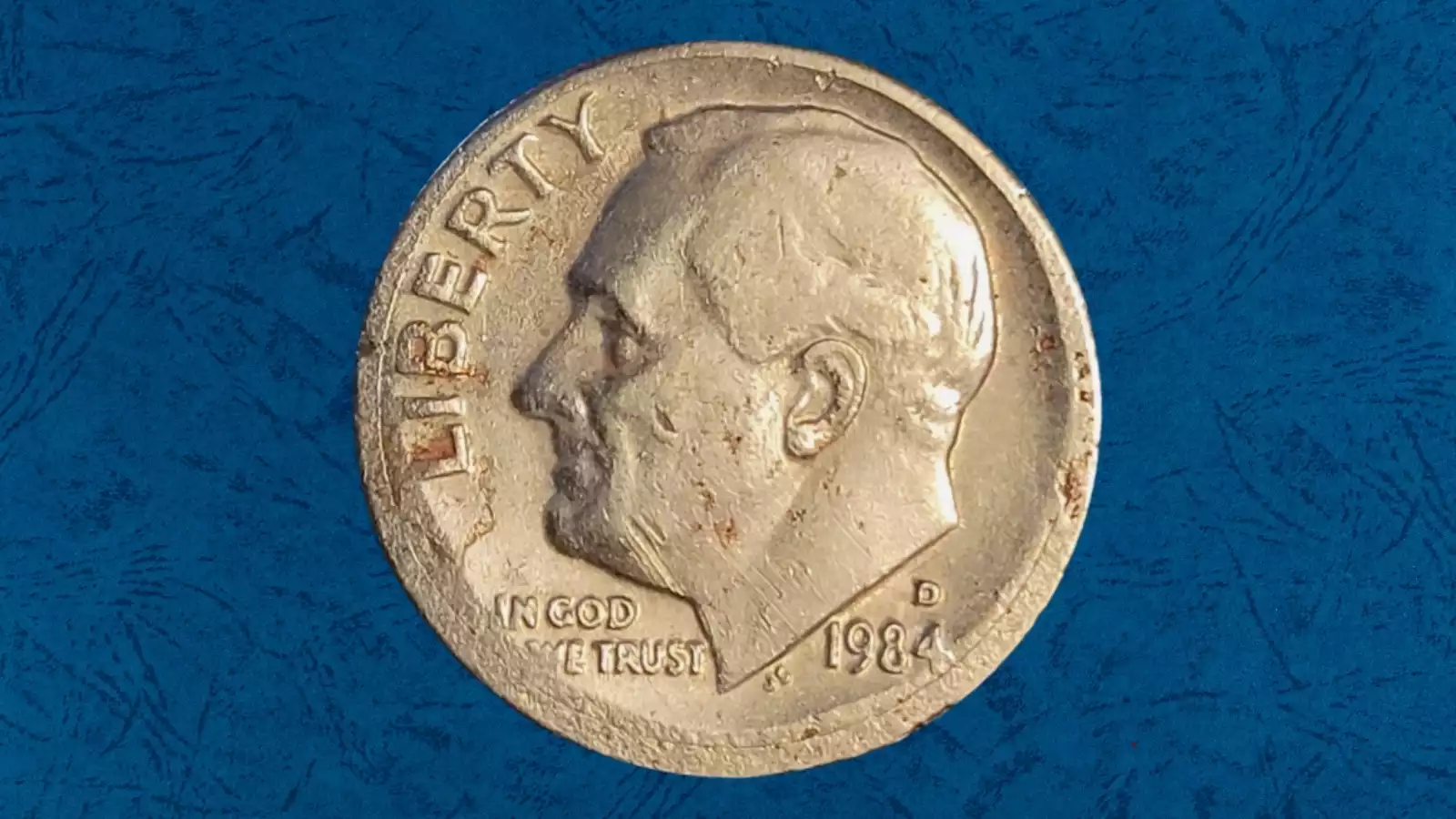 1984 dime broadstrike error showing expanded diameter and plain unreeeded edge